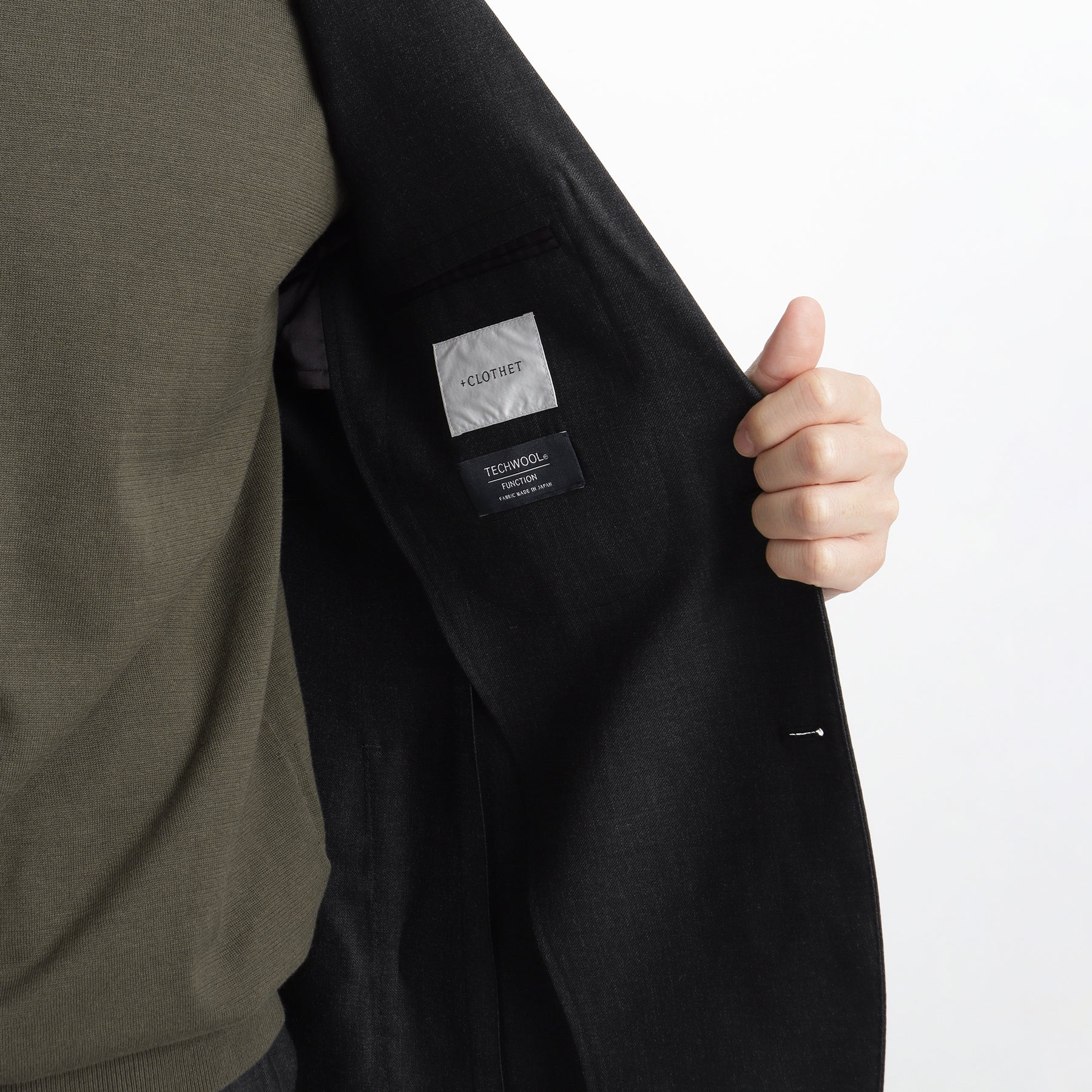 テックウール ®ツイル テーラードジャケットチャコールの内側を写したメンズ着用画像