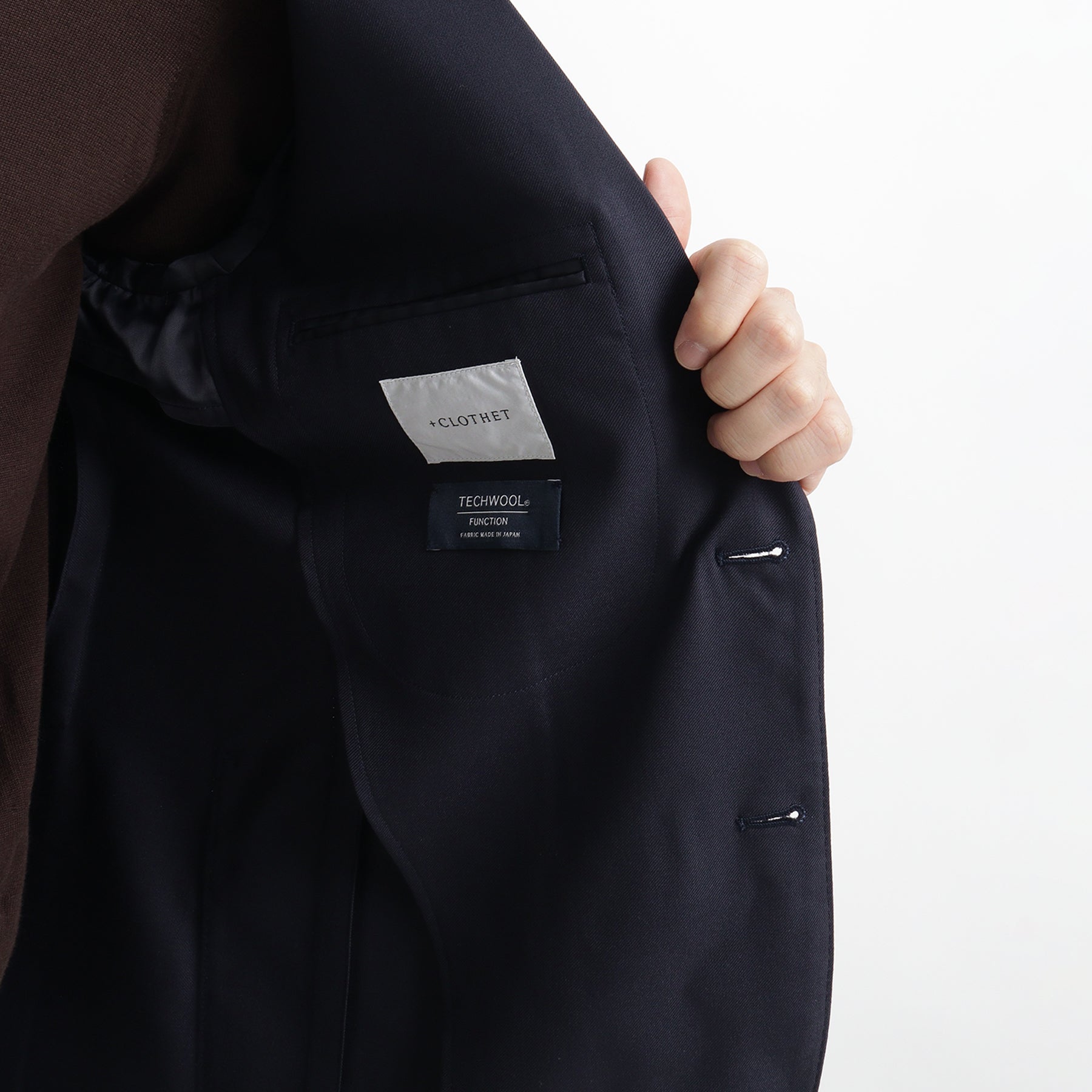 テックウール ®ツイル テーラードジャケットネイビーの内側を写したメンズ着用画像